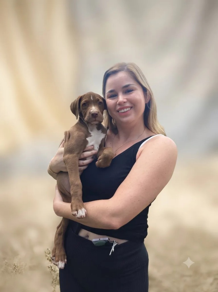 Skye, an adopted dog with her new owner